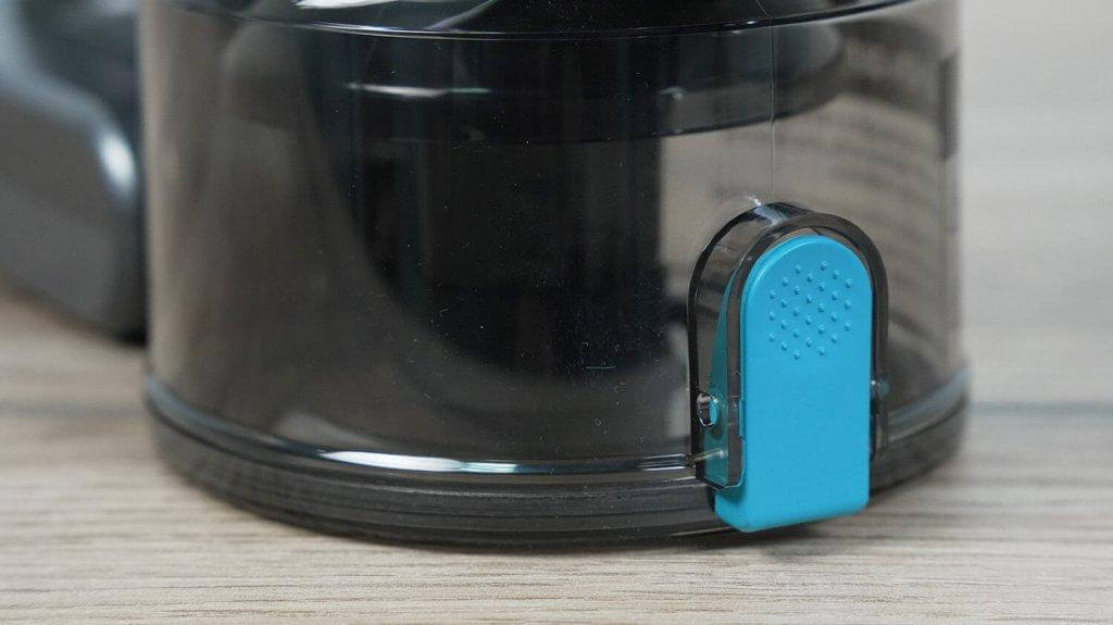 Teqqo Powerstick BASIC : Bouton de vidage du bac à poussière